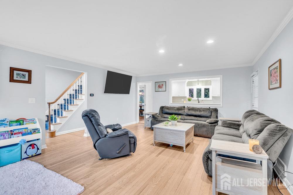 110 Springcrest Drive Hightstown, NJ 08520 - Photo 6 of 44 a living room with furniture and a wooden floor