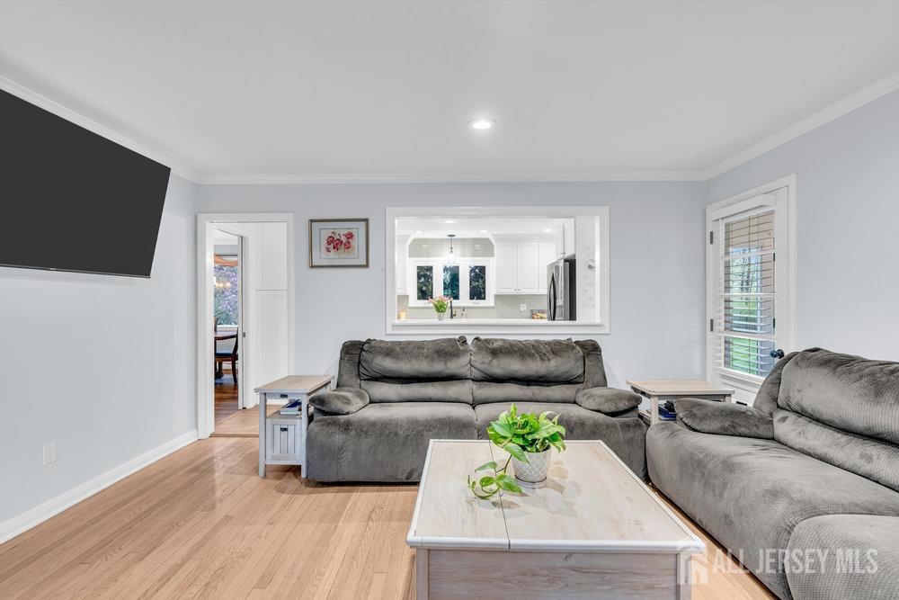 110 Springcrest Drive Hightstown, NJ 08520 - Photo 7 of 44 a living room with furniture and a flat screen tv