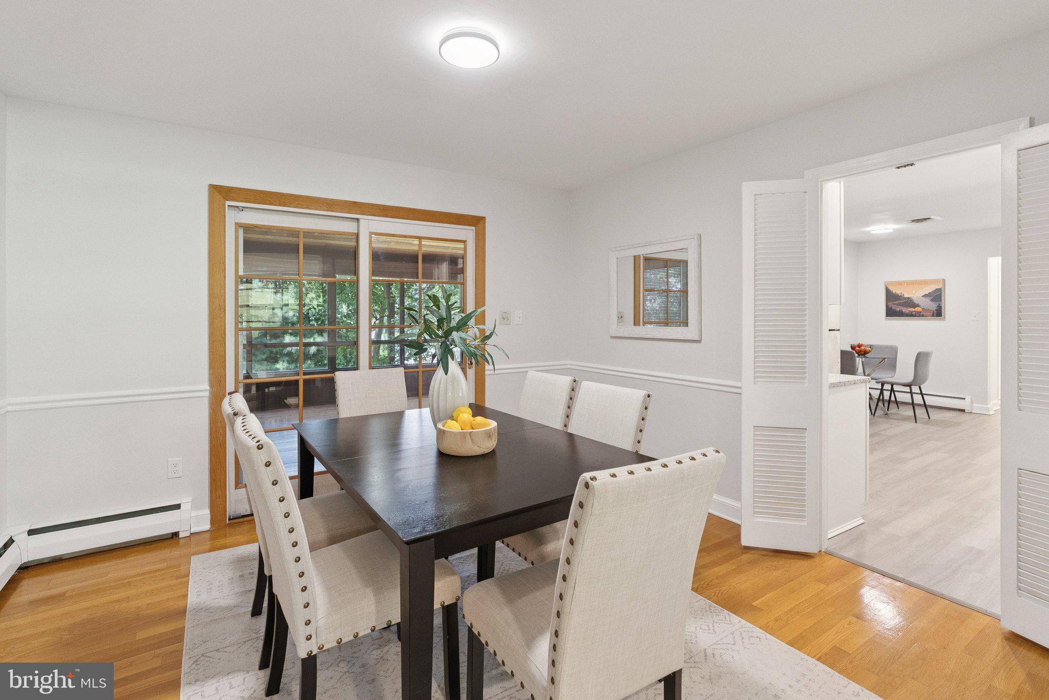 111 Marine Terrace Silver Spring, MD 20905 - Photo 11 of 40 a view of a dining room with furniture and wooden floor