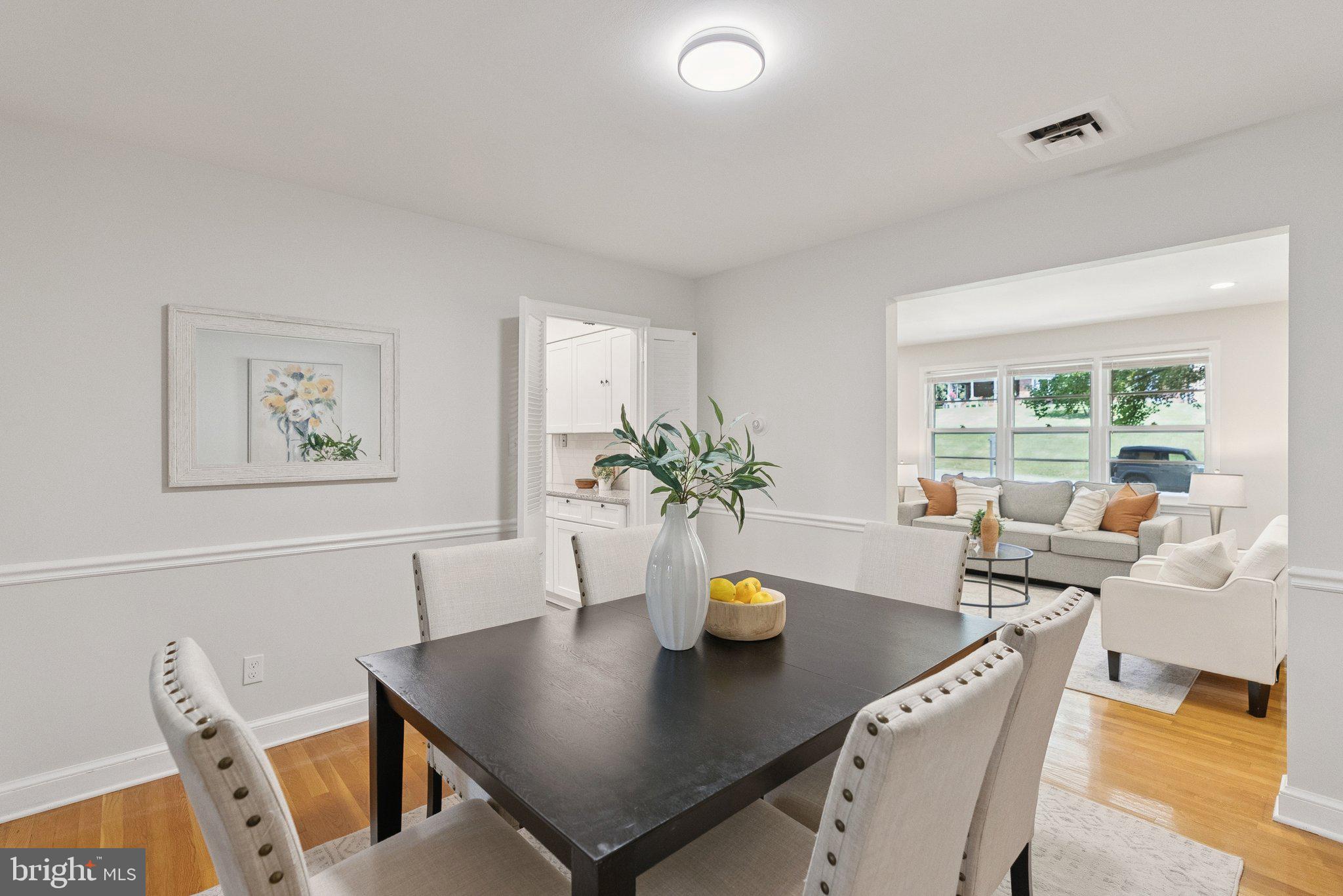 111 Marine Terrace Silver Spring, MD 20905 - Photo 10 of 40 a view of a dining room with furniture and a potted plant