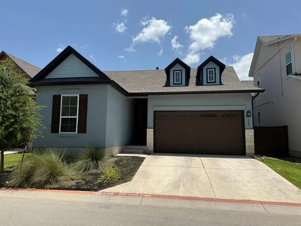 a front view of a house with garage