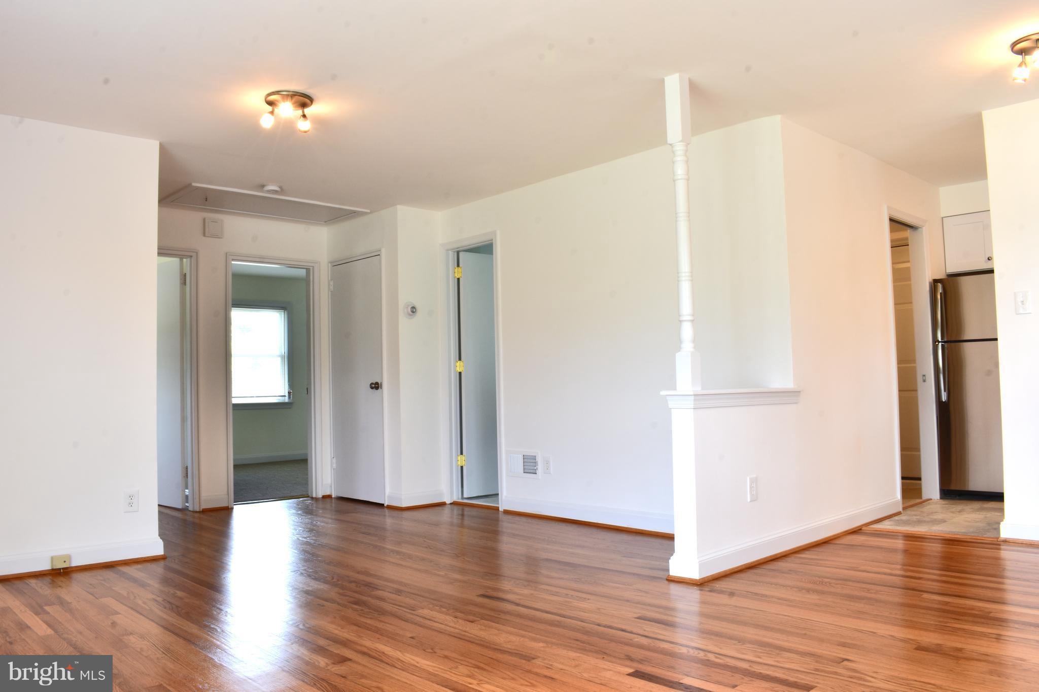12700 Georgia Avenue Silver Spring, MD 20906 - Photo 5 of 15 Living Room Gleaming hardwoods.