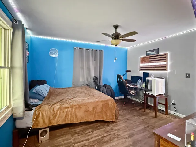 a bed room with a bed and a chandelier