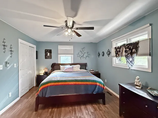 a bed room with a bed and a chandelier