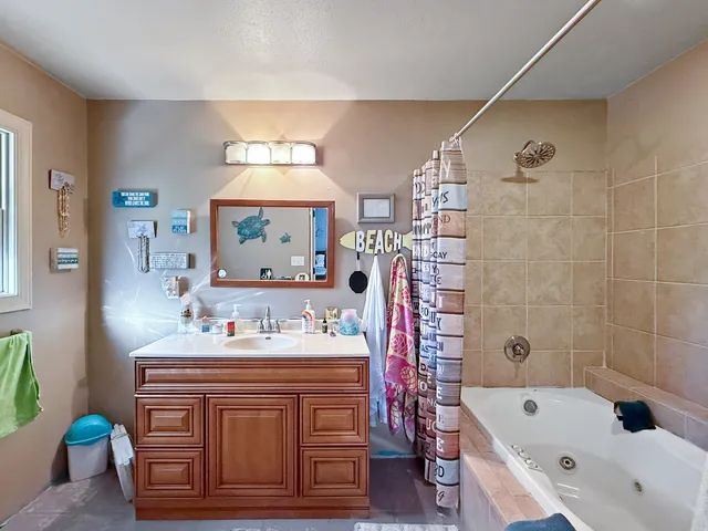 a spacious bathroom with a toilet a sink and mirror