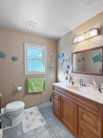 a bathroom with a double vanity sink a mirror and a bathtub