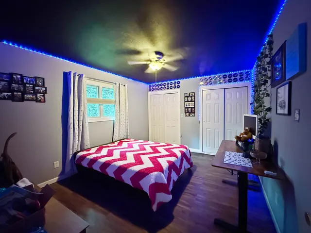 a bed room with two bed and a couch