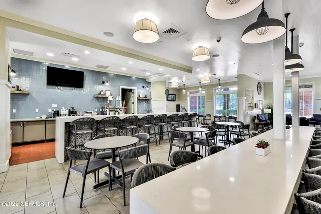 a view of swimming pool with outdoor seating