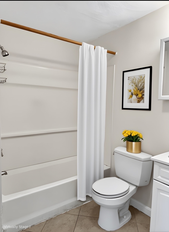 12 Paris Street, Unit 3 Boston, MA 02128 - Photo 6 of 7 a white toilet sitting next to a bathroom sink