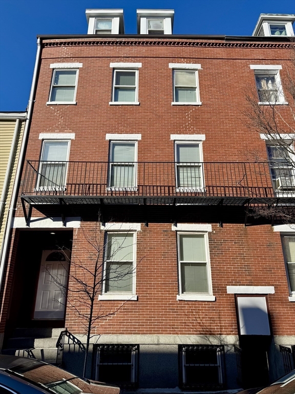 12 Paris Street, Unit 3 Boston, MA 02128 - Photo 7 of 7 a building view with a roof deck