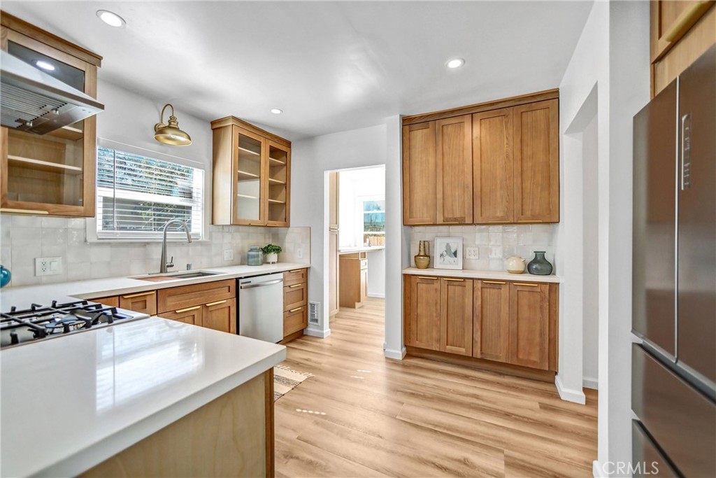 1925 Lundy Avenue Pasadena, CA 91104 - Photo 12 of 47 a kitchen with stainless steel appliances granite countertop a sink stove and refrigerator