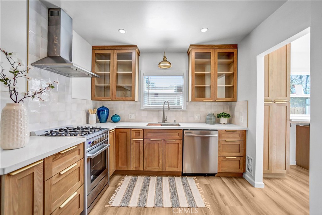 1925 Lundy Avenue Pasadena, CA 91104 - Photo 13 of 47 a kitchen with stainless steel appliances granite countertop a stove and a sink