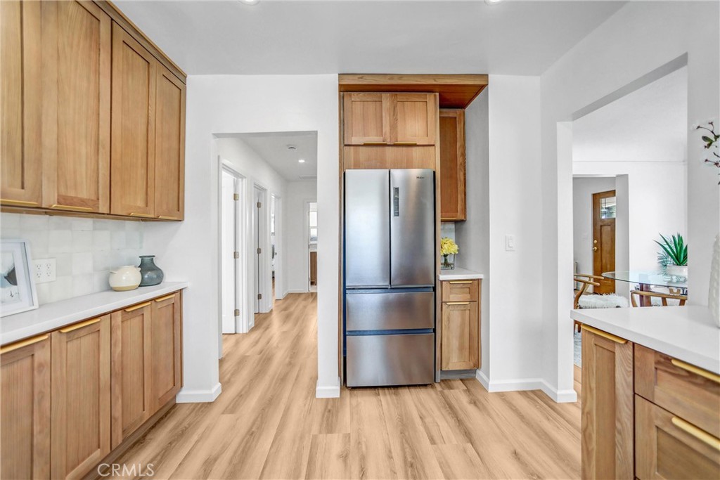 1925 Lundy Avenue Pasadena, CA 91104 - Photo 15 of 47 a kitchen with kitchen island wooden floors appliances and cabinets