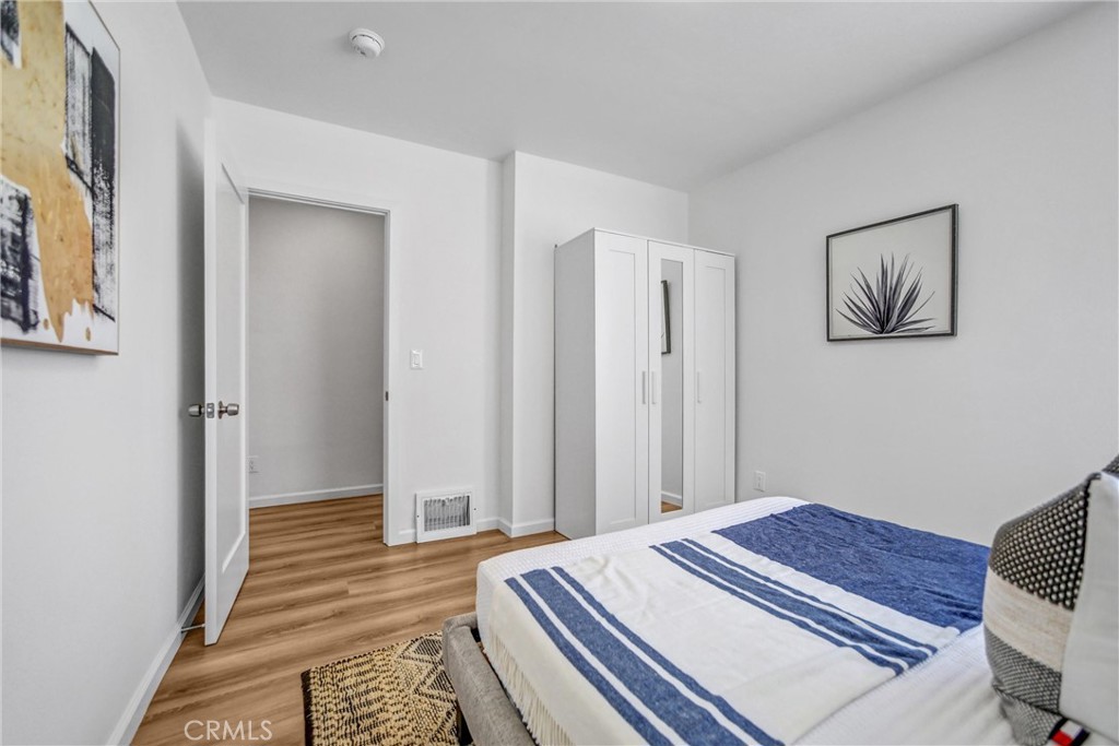 1925 Lundy Avenue Pasadena, CA 91104 - Photo 17 of 47 a bedroom with a bed and a painting on the wall