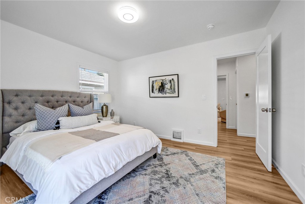 1925 Lundy Avenue Pasadena, CA 91104 - Photo 20 of 47 a bedroom with bed and a painting on the wall