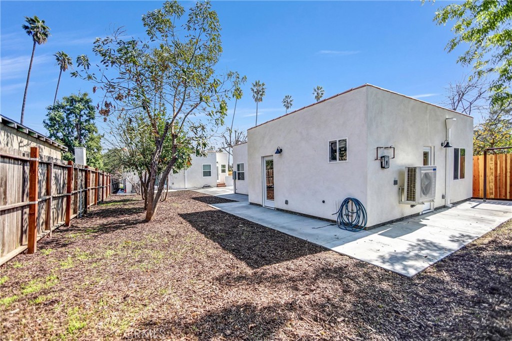 1925 Lundy Avenue Pasadena, CA 91104 - Photo 26 of 47 a view of a white house with a yard and tree in the background