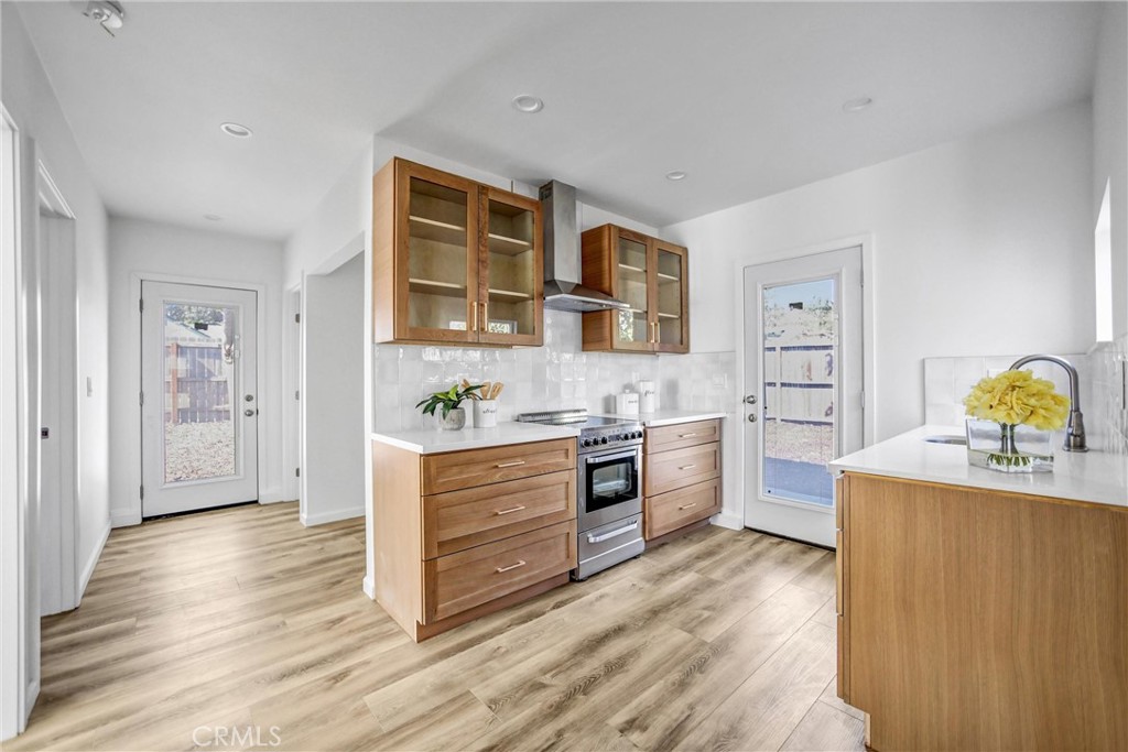 1925 Lundy Avenue Pasadena, CA 91104 - Photo 32 of 47 a kitchen with stainless steel appliances a stove and cabinets