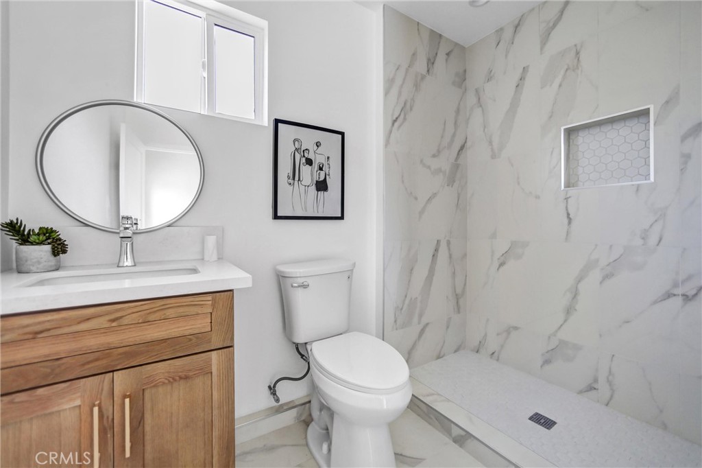 1925 Lundy Avenue Pasadena, CA 91104 - Photo 34 of 47 a bathroom with a toilet sink and mirror