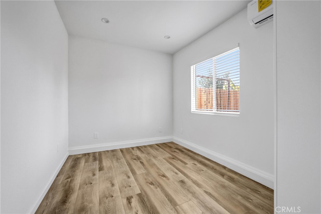 1925 Lundy Avenue Pasadena, CA 91104 - Photo 35 of 47 an empty room with wooden floor and windows