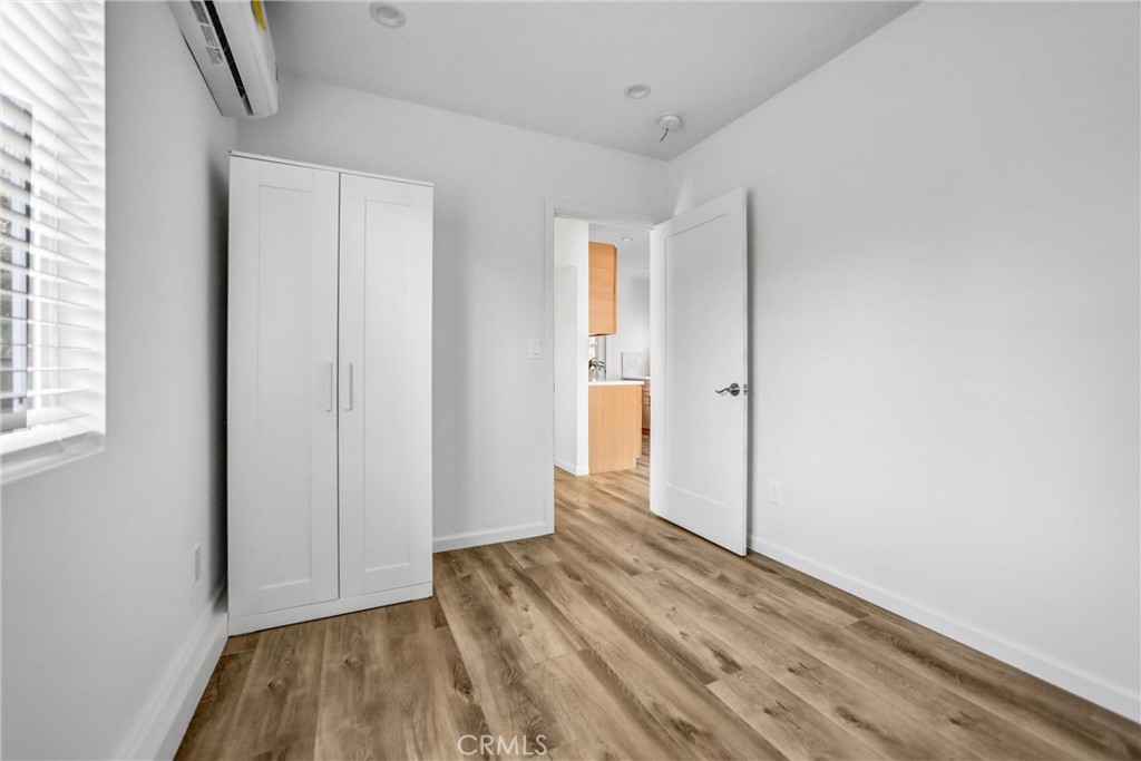 1925 Lundy Avenue Pasadena, CA 91104 - Photo 36 of 47 a view of a room with wooden floor and a bathroom