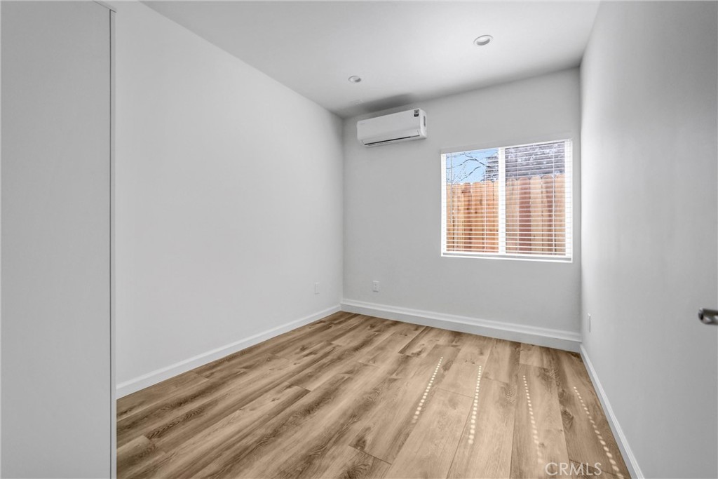 1925 Lundy Avenue Pasadena, CA 91104 - Photo 37 of 47 a view of an empty room with wooden floor and a window