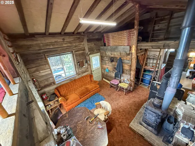 a outdoor living space with patio furniture and a fireplace
