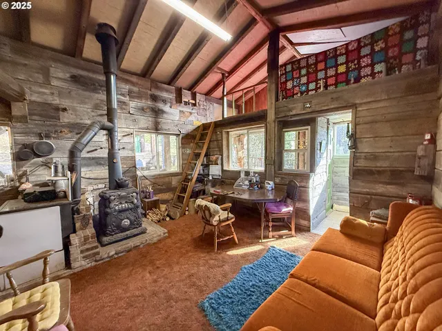 a balcony with furniture and wooden floor