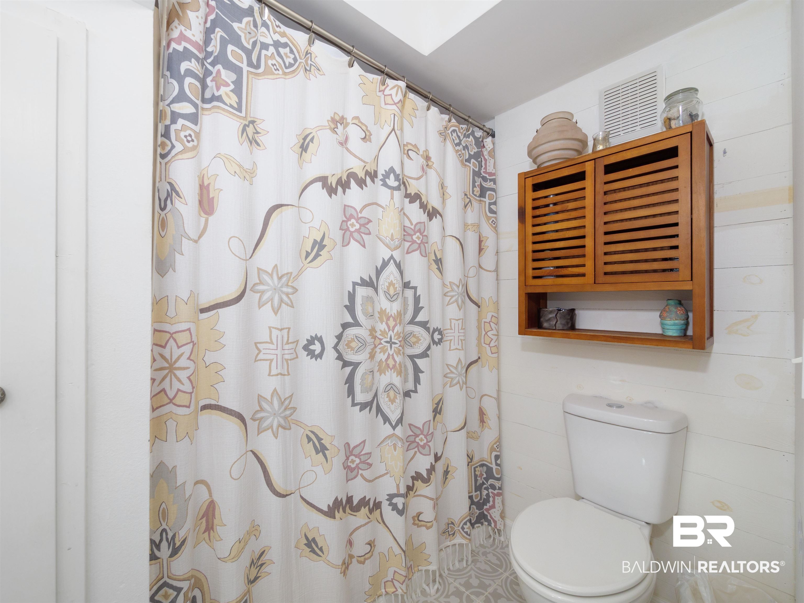 494 Ridgewood Drive Daphne, AL 36526 - Photo 19 of 40 Bathroom with a shower with shower curtain and toilet