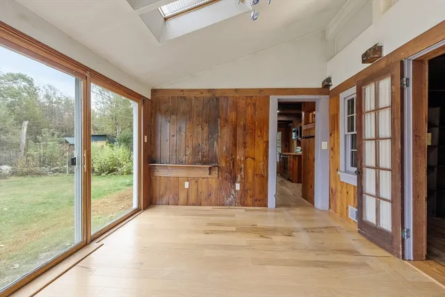 a view of a room with a large window