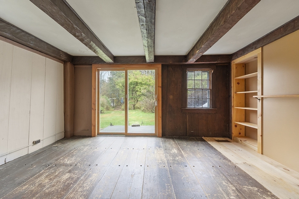 350 Athol-Richmond Road Royalston, MA 01368 - Photo 17 of 40 a view of an empty room with a window and wooden floor