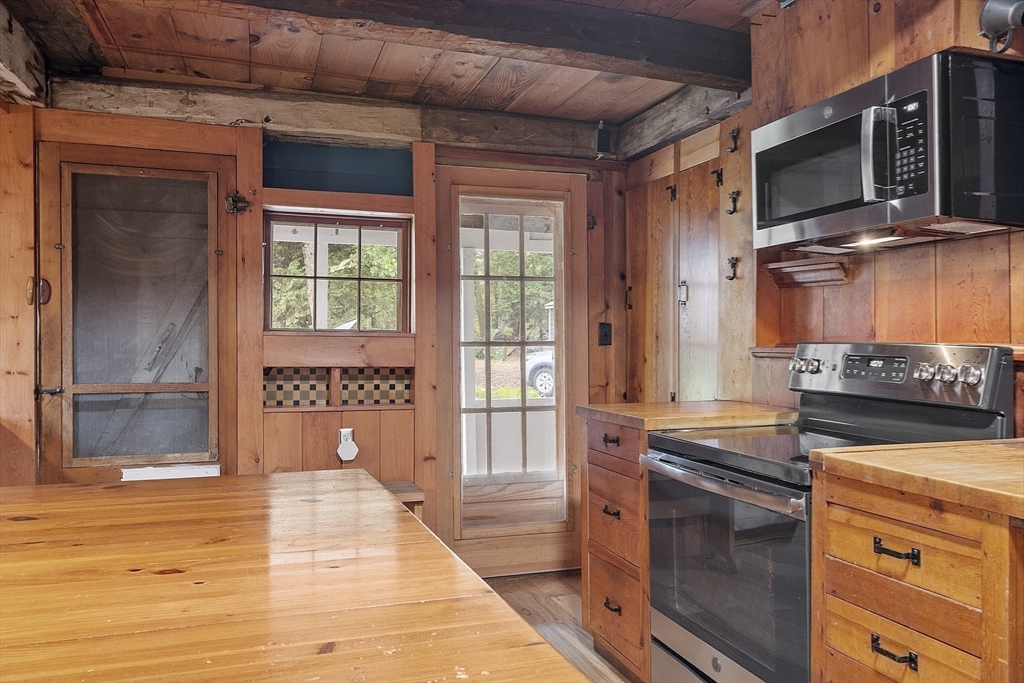 350 Athol-Richmond Road Royalston, MA 01368 - Photo 18 of 40 a kitchen with a stove and a microwave