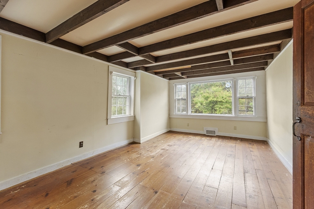 350 Athol-Richmond Road Royalston, MA 01368 - Photo 23 of 40 a view of an empty room with wooden floor and a window