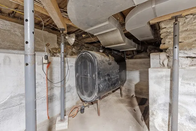 a front view of a house with a tree