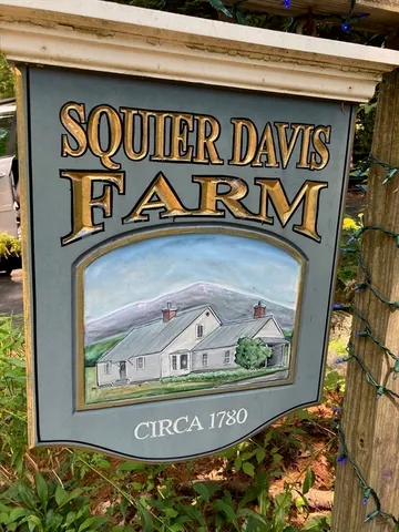 a sign on top of a wall