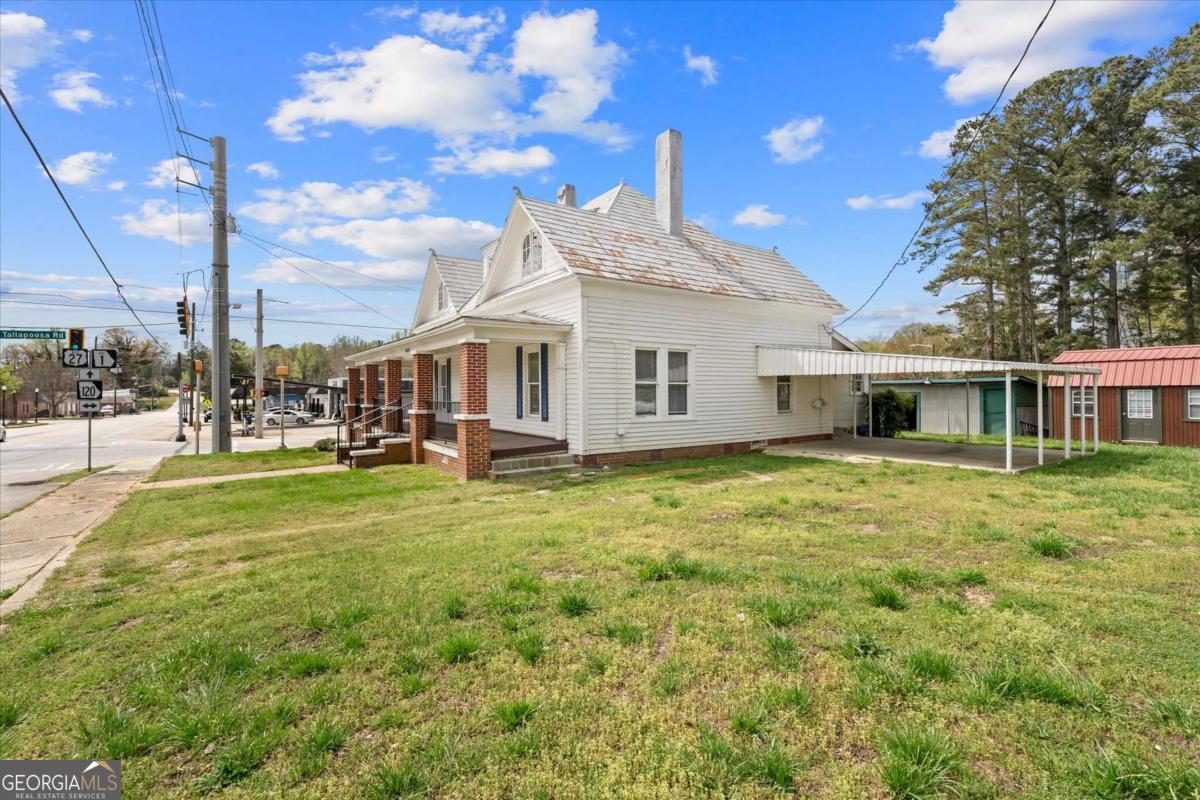 3608 Us Highway Buchanan, GA 30113 - Photo 12 of 51 a front view of a house with garden