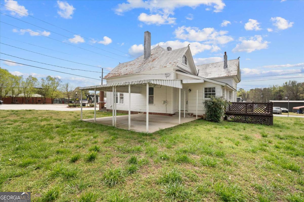 3608 Us Highway Buchanan, GA 30113 - Photo 13 of 50 a view of a house with a backyard porch and sitting area