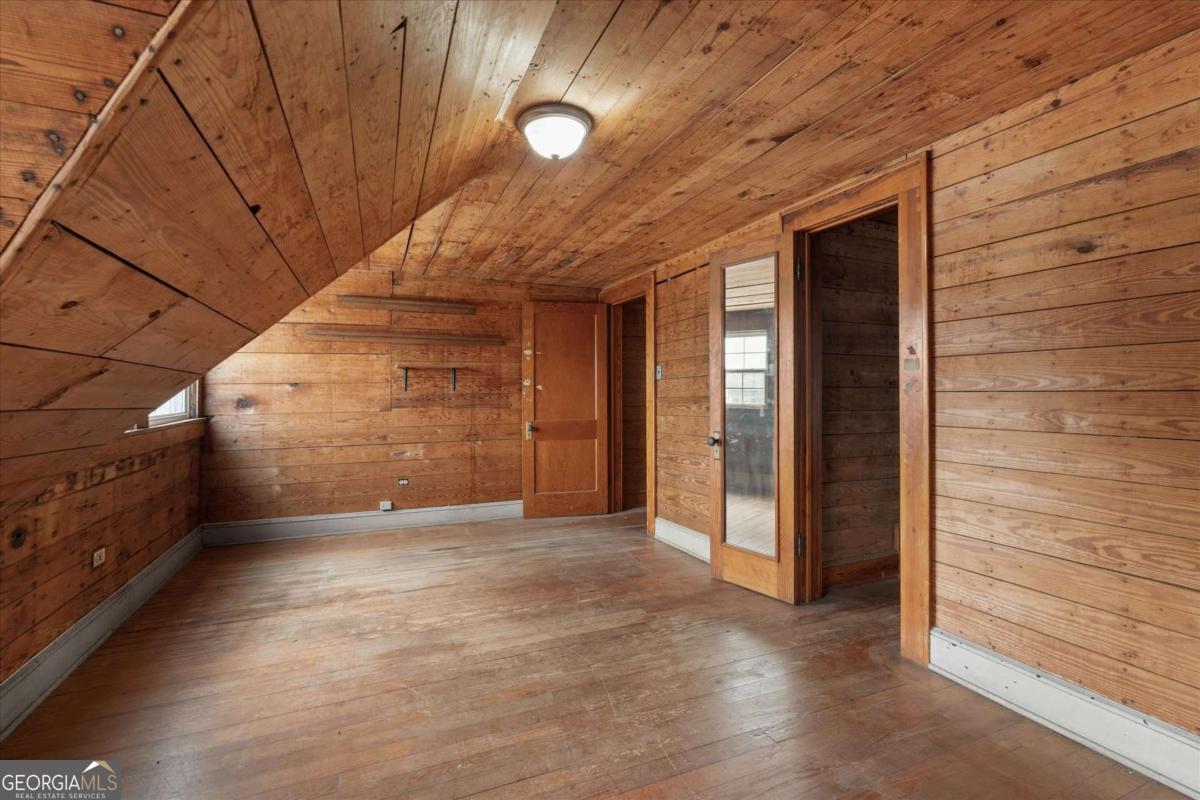 3608 Us Highway Buchanan, GA 30113 - Photo 21 of 50 a view of a hallway with wooden walls
