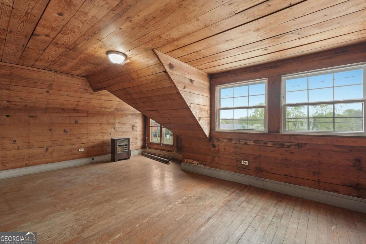 3608 Us Highway Buchanan, GA 30113 - Photo 22 of 50 a view of an empty room with wooden floor and a window