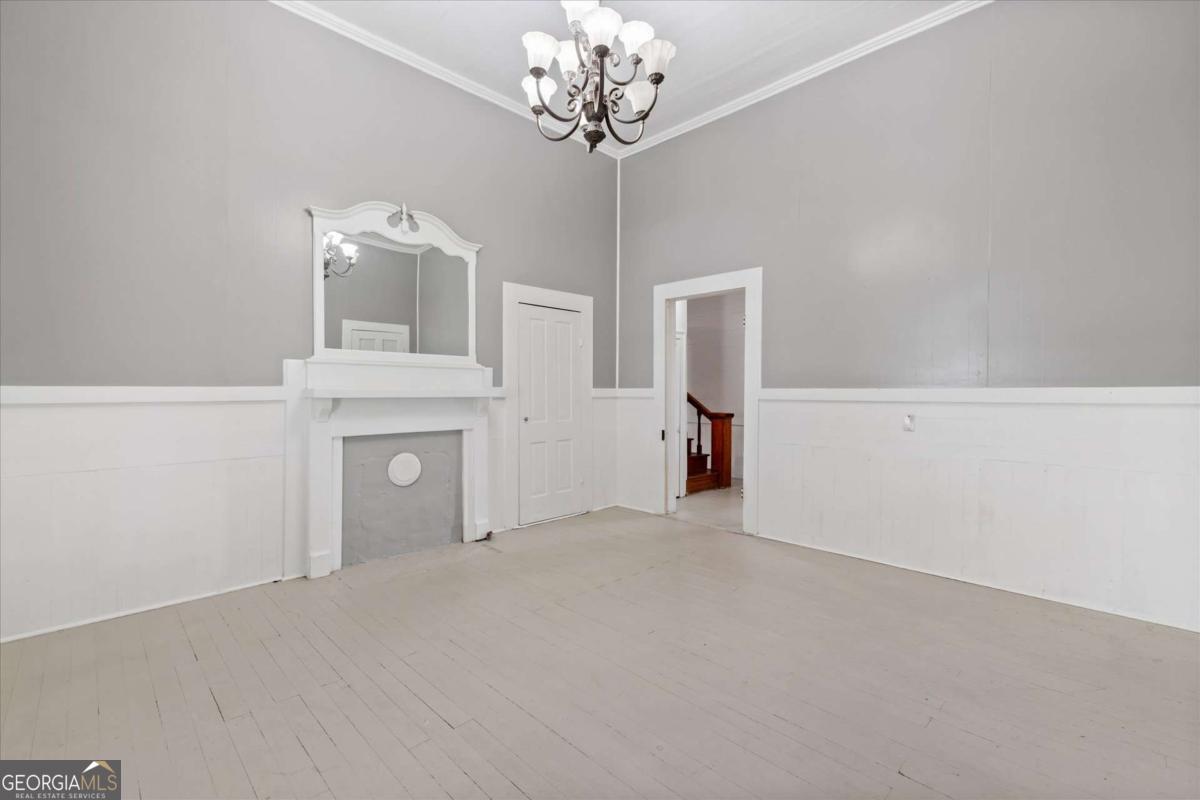 3608 Us Highway Buchanan, GA 30113 - Photo 31 of 50 a view of a room with a chandelier and fireplace