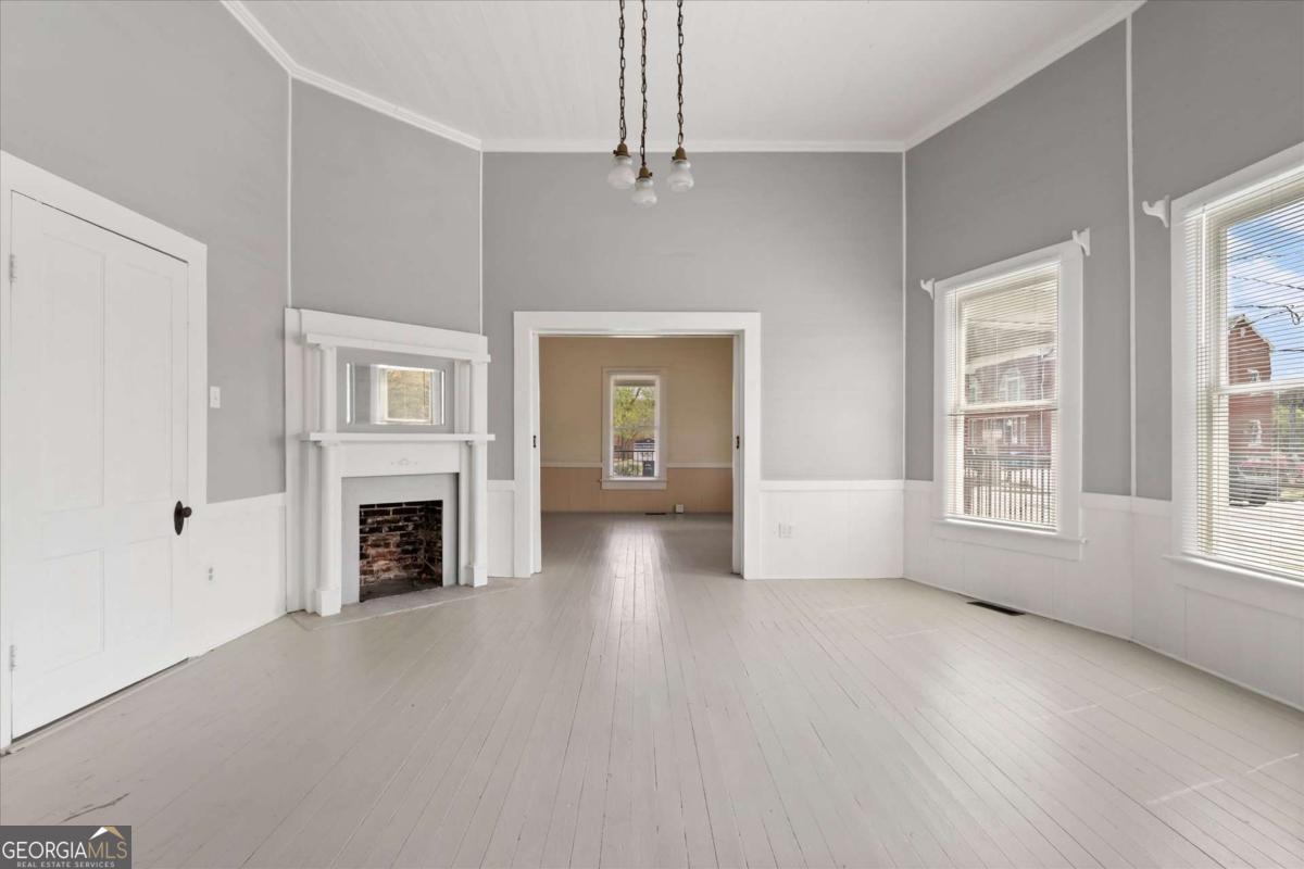 3608 Us Highway Buchanan, GA 30113 - Photo 36 of 50 a view of empty room with fireplace and wooden floor