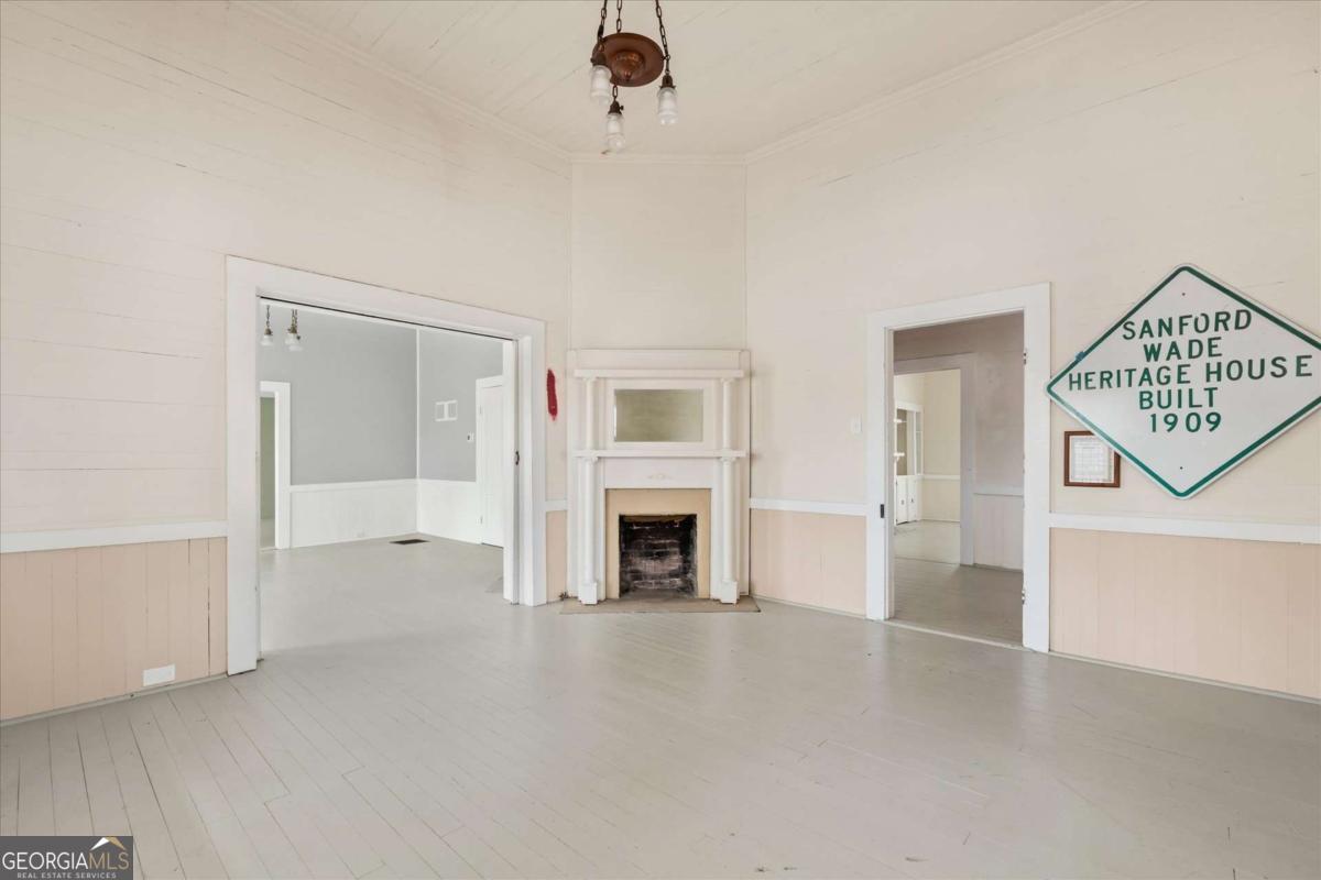 3608 Us Highway Buchanan, GA 30113 - Photo 37 of 50 an empty room with windows and fireplace