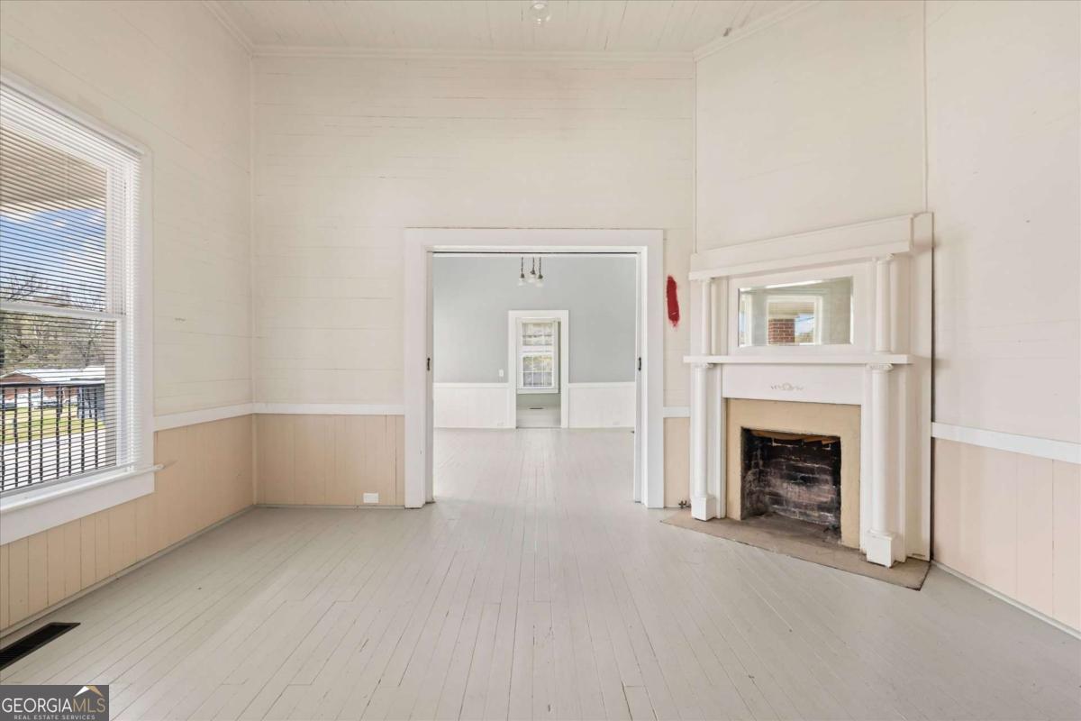 3608 Us Highway Buchanan, GA 30113 - Photo 38 of 50 wooden floor fireplace and windows in an empty room