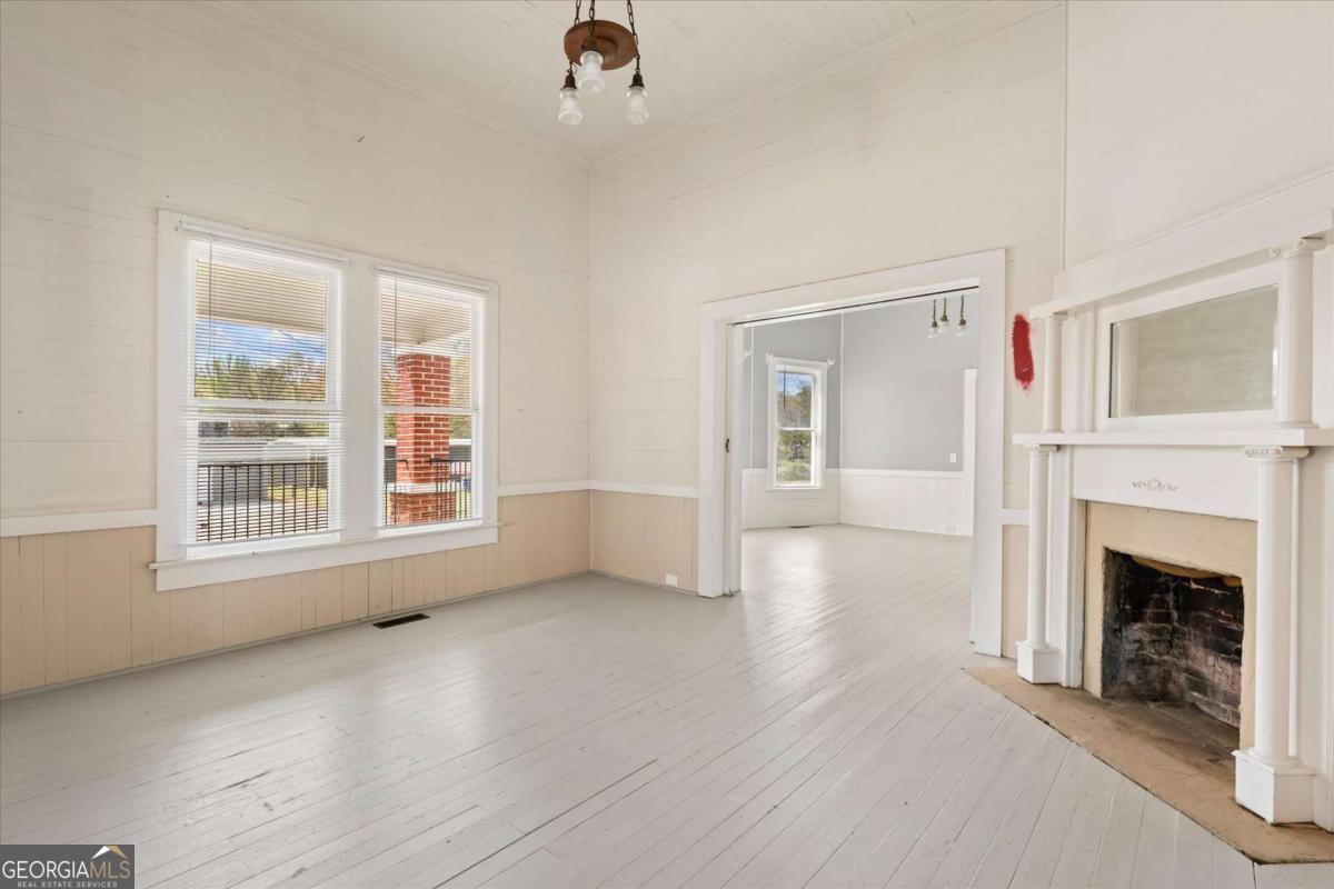 3608 Us Highway Buchanan, GA 30113 - Photo 39 of 50 an empty room with windows and fireplace