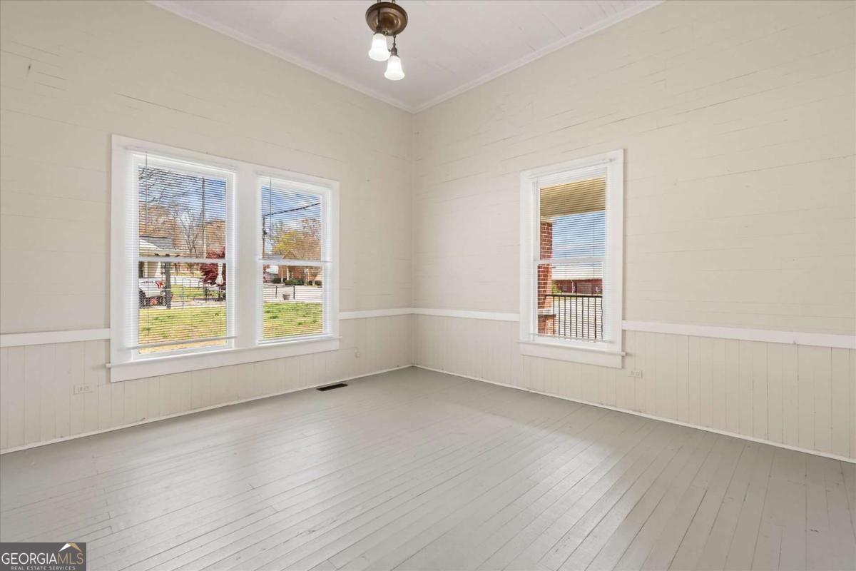3608 Us Highway Buchanan, GA 30113 - Photo 42 of 50 an empty room with wooden floor and windows