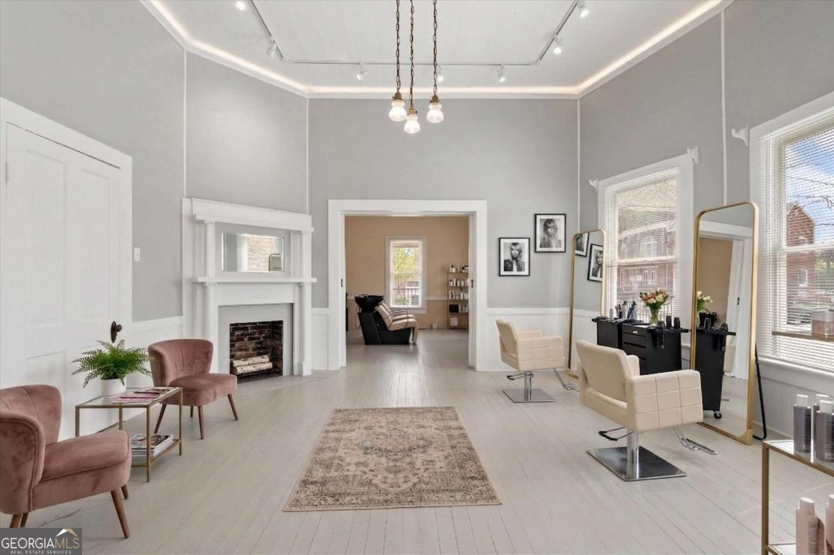 3608 Us Highway Buchanan, GA 30113 - Photo 5 of 50 a living room with furniture a fireplace and a chandelier