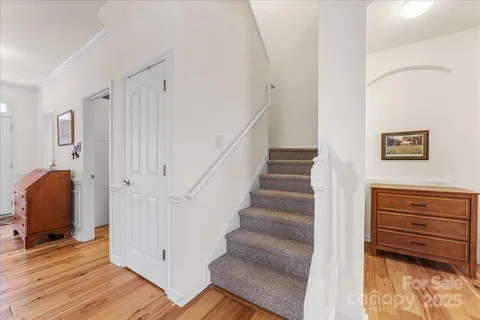 a view of entryway with stairs and wooden floor