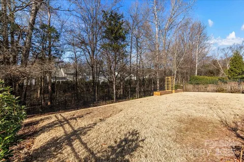 a view of a house with a yard covered in snow