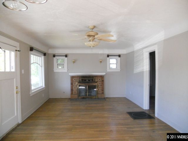 515 Burns Street, Unit B Reno, NV 89502 - Photo 2 of 9 a view of livingroom with furniture fireplace and window