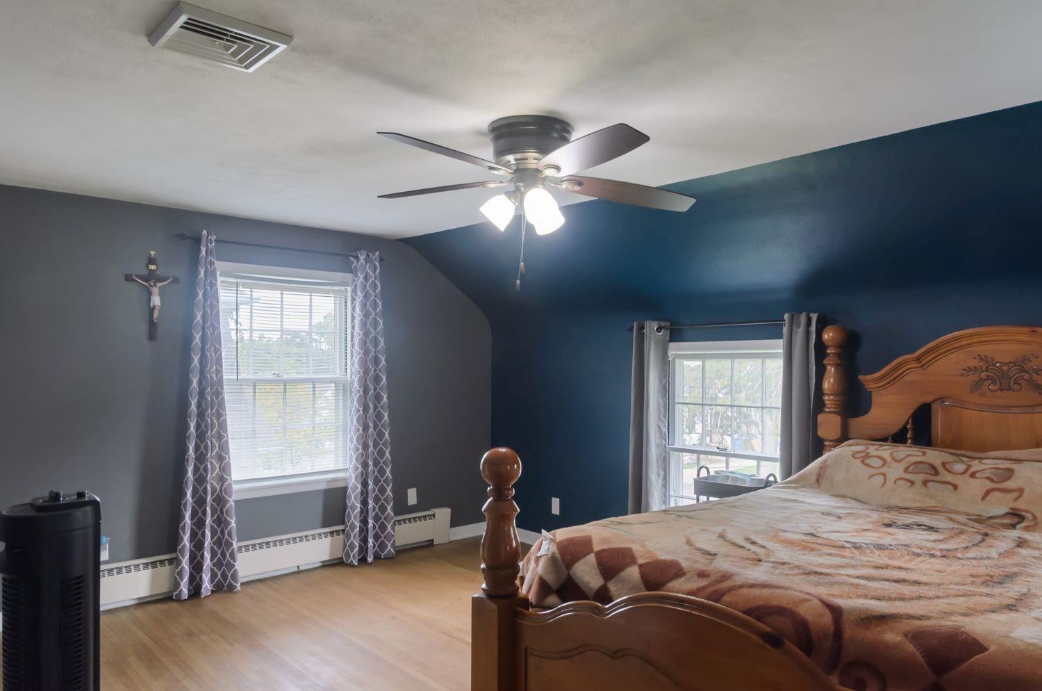 736 East 3rd Street Dixon, IL 61021 - Photo 11 of 29 a bedroom with a bed and a chandelier