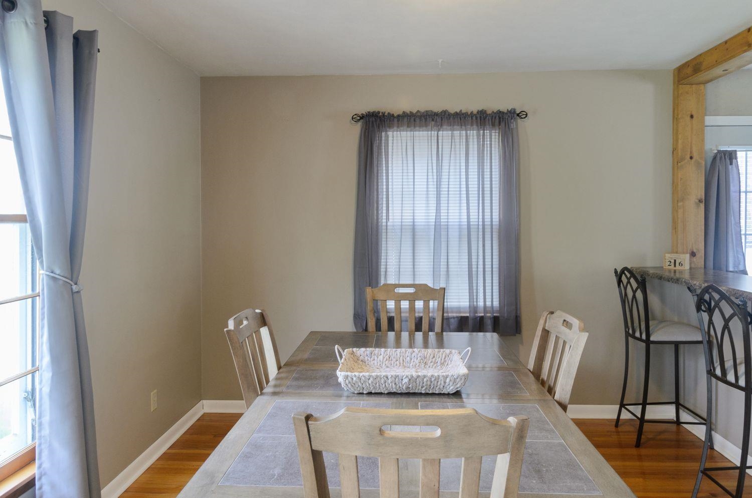 736 East 3rd Street Dixon, IL 61021 - Photo 12 of 29 a dining room with furniture and wooden floor